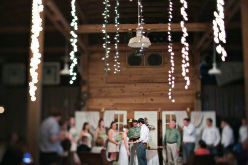 Christmas lights in barn wedding