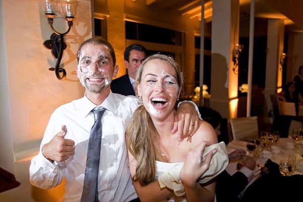 happy couple wedding cake smash